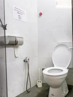 a bathroom with a toilet and a shower at Lodge 22, 5 min walk to Adventist & Pulau Tikus Market in George Town