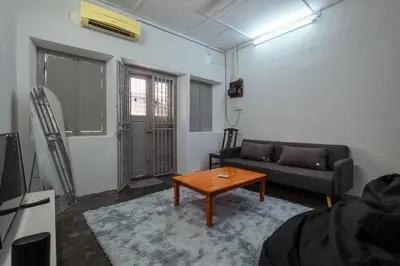 a living room with a couch and a coffee table at Hutton Haven by MyStay in George Town
