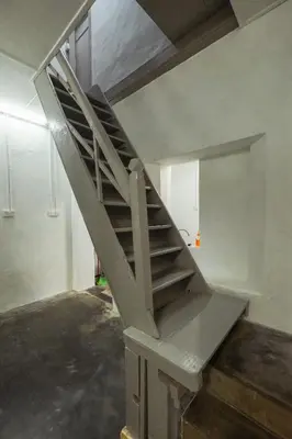 a metal staircase in a room with a wall at Hutton Haven by MyStay in George Town