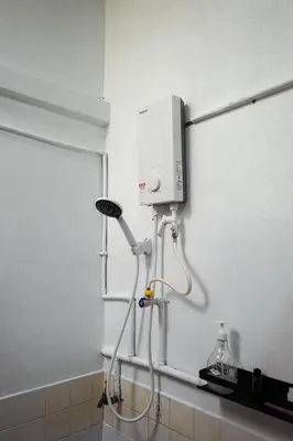 a shower in the corner of a bathroom at Hutton Haven by MyStay in George Town