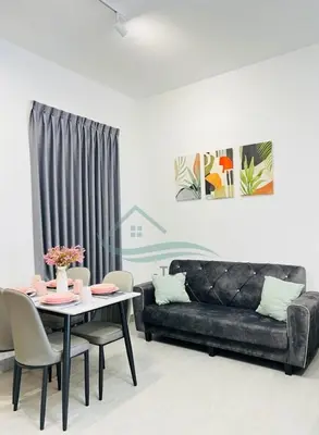 a living room with a couch and a table at Venus Suite in Setia Alam 2 in Gua Sai