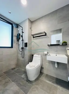 a bathroom with a toilet and a sink at Venus Suite in Setia Alam 2 in Gua Sai