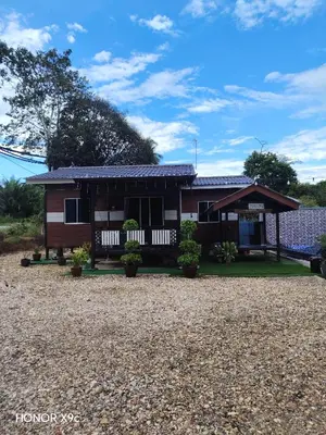 a house on the side of the road at Homestay Teratak D'Desa in Gua Sai