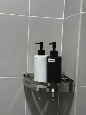 two rolls of toilet paper on a shelf in a bathroom at Modern & Cozy Home Stay in Kampar