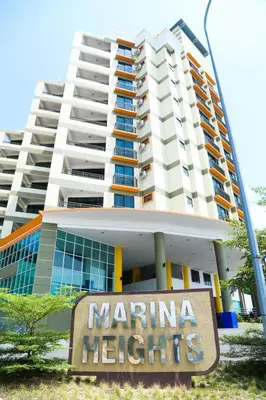 a building with a marina heights sign in front of it at 3B2BR Marina Height Seaview room Rose in Lumut