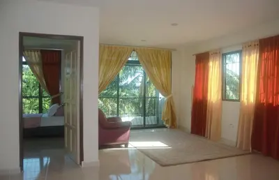 a living room with a couch and a window at Kulim LakeView Homestay for Msliims Only in Kulim