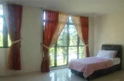 a bedroom with a bed and a large window at Kulim LakeView Homestay for Msliims Only in Kulim