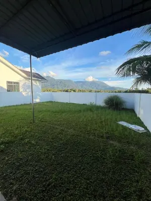 a view from the patio of a house with a view of the ocean at Villa Umar Home Stay in Gua Sai