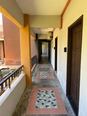 an empty hallway of a building with a door at DamaiNest in Lumut