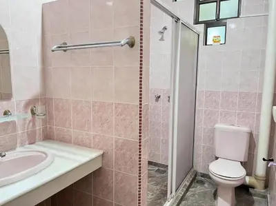 a bathroom with a sink and a toilet and a shower at Menglembu Hill Home Stay in Ipoh