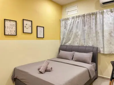 a small bedroom with a bed with a window at Vintage CoLiving 2Storey Haus in Bukit Mertajam