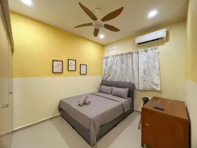 a bedroom with a bed and a ceiling fan at Vintage CoLiving 2Storey Haus in Bukit Mertajam