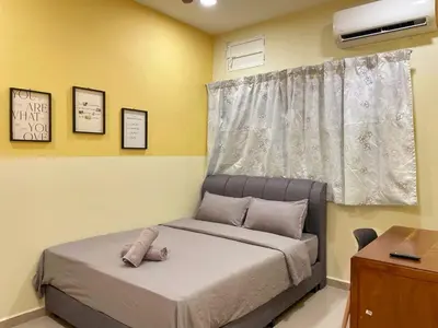 a small bedroom with a bed with a window at Vintage CoLiving 2Storey Haus in Bukit Mertajam
