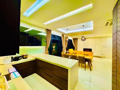 a kitchen with a table and a dining room at Private Pool Villa Near Batu Ferringhi Beach in Batu Ferringhi