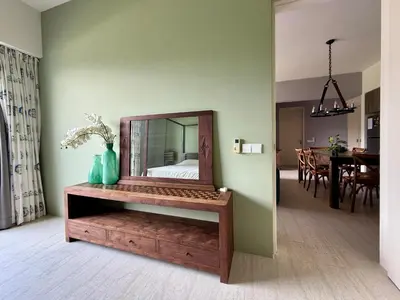 a mirror on a wooden dresser in a room at By The Sea Batu Ferringhi, Penang Beach in Batu Ferringhi
