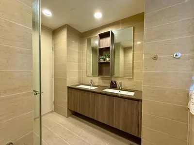 a bathroom with two sinks and a mirror at By The Sea Batu Ferringhi, Penang Beach in Batu Ferringhi