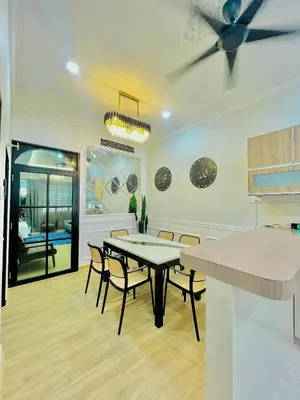 a dining room with a table and chairs at Homestay Deedora 87 in Seri Manjung