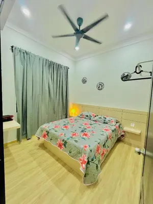a bedroom with a bed and a ceiling fan at Homestay Deedora 87 in Seri Manjung