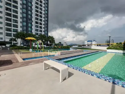 a swimming pool with a bench next to some buildings at Galaxy Luxury Homestay in Bukit Mertajam
