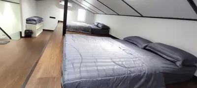 a bedroom with two beds in a room at Akasea Sojourn in Gua Sai