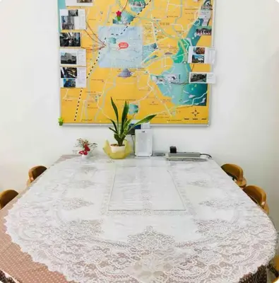 a table with a white table cloth on top of it at GA Homes Homestay - Majestic Ipoh Condo in Ipoh