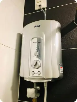 a white appliance is attached to a wall at GA Homes Homestay - Majestic Ipoh Condo in Ipoh