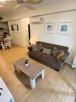 a living room with a couch and a coffee table at GA Homes Homestay - Majestic Ipoh Condo in Ipoh