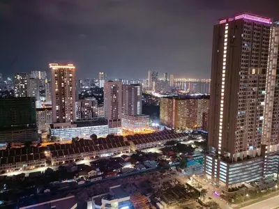a city skyline at night with tall buildings at Urban Suites Jelutong Georgetown 2BR Leisure City Night View in Jelutong
