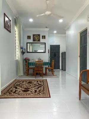 a living room with a table and a dining room at Che Puan Homestay Baling - 2 unit house with kids pool in Baling