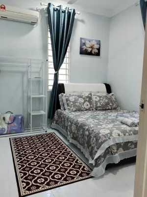 a bedroom with a bed and a window at Che Puan Homestay Baling - 2 unit house with kids pool in Baling
