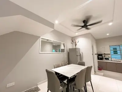 a dining room with a table and a ceiling fan at Fairy 2 Pool Villa Ipoh 26 Pax Kbox Snooker Lego in Ipoh