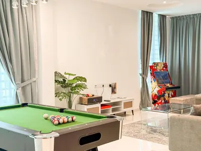 a living room with a pool table in it at Fairy 2 Pool Villa Ipoh 26 Pax Kbox Snooker Lego in Ipoh