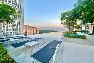 a row of chairs and tables on a balcony of a building at Georgetown Penang - Skyline at Urban Suites - Affordable-Luxury-Cozy Stays with Sea and City Views in Jelutong
