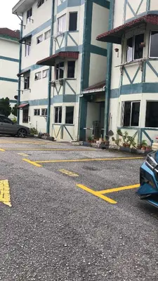 a parking lot in front of a building at Cool memories apartment in Tanah Rata