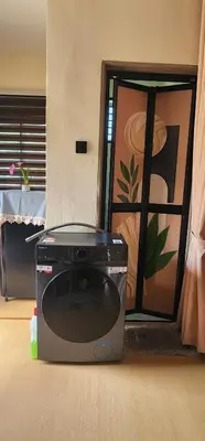 a television sitting on the floor in a room at Homestay Ummi Baling in Baling