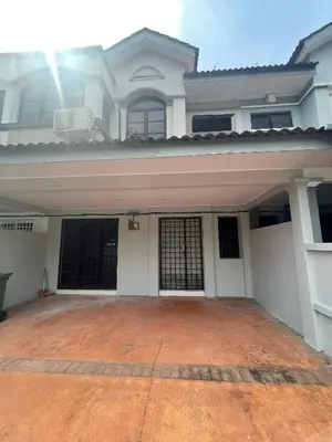 a large white house with a large driveway at Teratai Bunda Homestay Tambun in Tambun