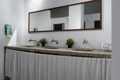 a bathroom with two sinks and a large mirror at A Cozy Place Penang in George Town