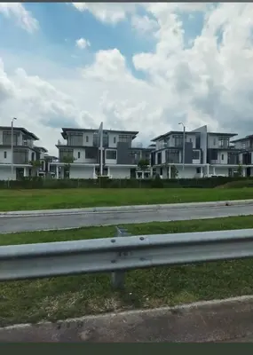 a row of houses on a street with a road at super hotel in Gua Sai