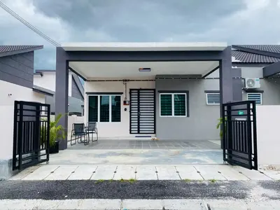 a house with a gate in front of it at Diyyans Homestay Ipoh in Ipoh