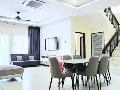 a dining room with a table and chairs and a couch at 14\u697c\u53cc\u5c42\u7a7a\u4e2d\u522b\u5885 Double Storey Penthouse Spacious Common Space for Gathering in Sekincan