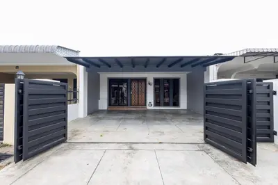a front door of a house with black doors at Yenny Cottage - Canning Private House Spacious in Ipoh