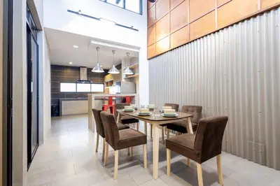 a dining room with a table and some chairs at Yenny Cottage - Canning Private House Spacious in Ipoh