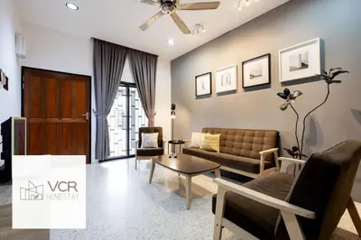 a living room with a couch and a table at Yenny Cottage - Canning Private House Spacious in Ipoh
