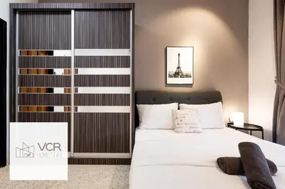 a bedroom with a bed and a tower in the background at Yenny Cottage - Canning Private House Spacious in Ipoh