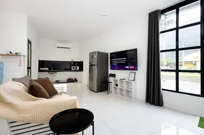 a living room with a couch and a refrigerator at Casa Bella - Private Studio Ipoh - Pet allowed in Ipoh