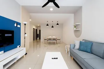 a living room with a couch and a table at Arctic Breeze - Pengkalan WaterPark Pool Gym in Ipoh