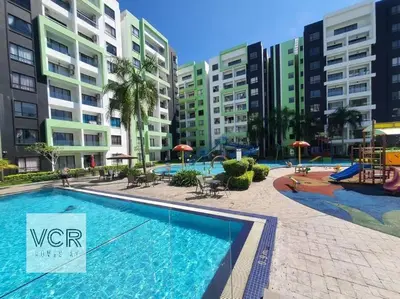 a large swimming pool in front of some apartment buildings at Arctic Breeze - Pengkalan WaterPark Pool Gym in Ipoh