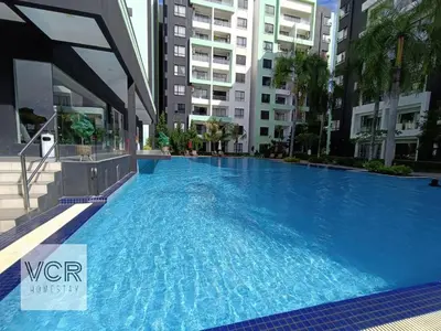 a large swimming pool in the middle of a building at Arctic Breeze - Pengkalan WaterPark Pool Gym in Ipoh