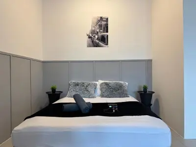 a bedroom with a large bed in a room at Ipoh Modern Family Retreat in Ipoh
