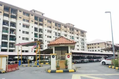 a parking lot with a gazebo in front of a building at Klang Prima Bayu Apartment, Taman Bayu Perdana, 42000 Klang in Gua Sai